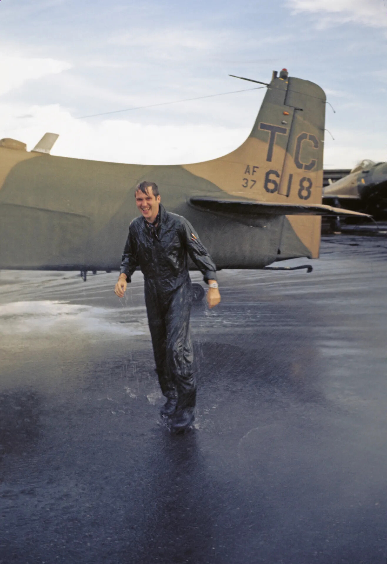 Pilot Celebrates Mission Milestone Beside A-1 Skyraider, Tail Code 'TC'