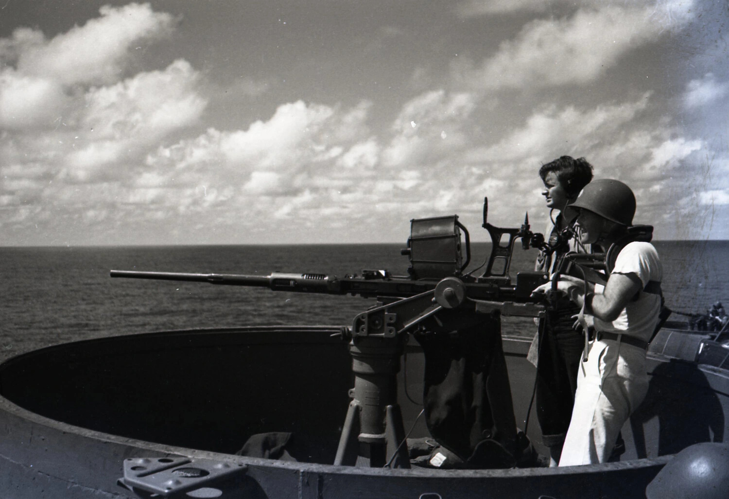 U.S. Navy Gun Crew Manning .50 Caliber Machine Gun at Sea, WWII Era