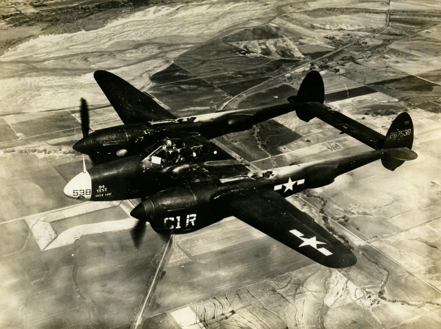 Lockheed P-38 Lightning "Queen Anne" (Serial 267538) in Banking Flight Over Farmland