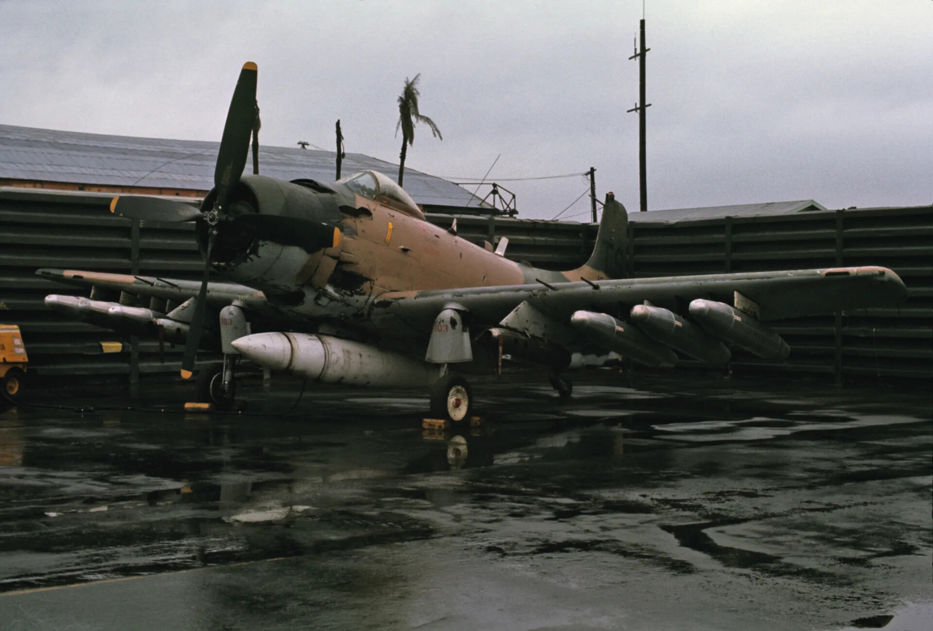 Douglas A-1 Skyraider on Wet Ramp Beside Blast Revetments, Companion Frame, Southeast Asian Air Base, circa 1970
