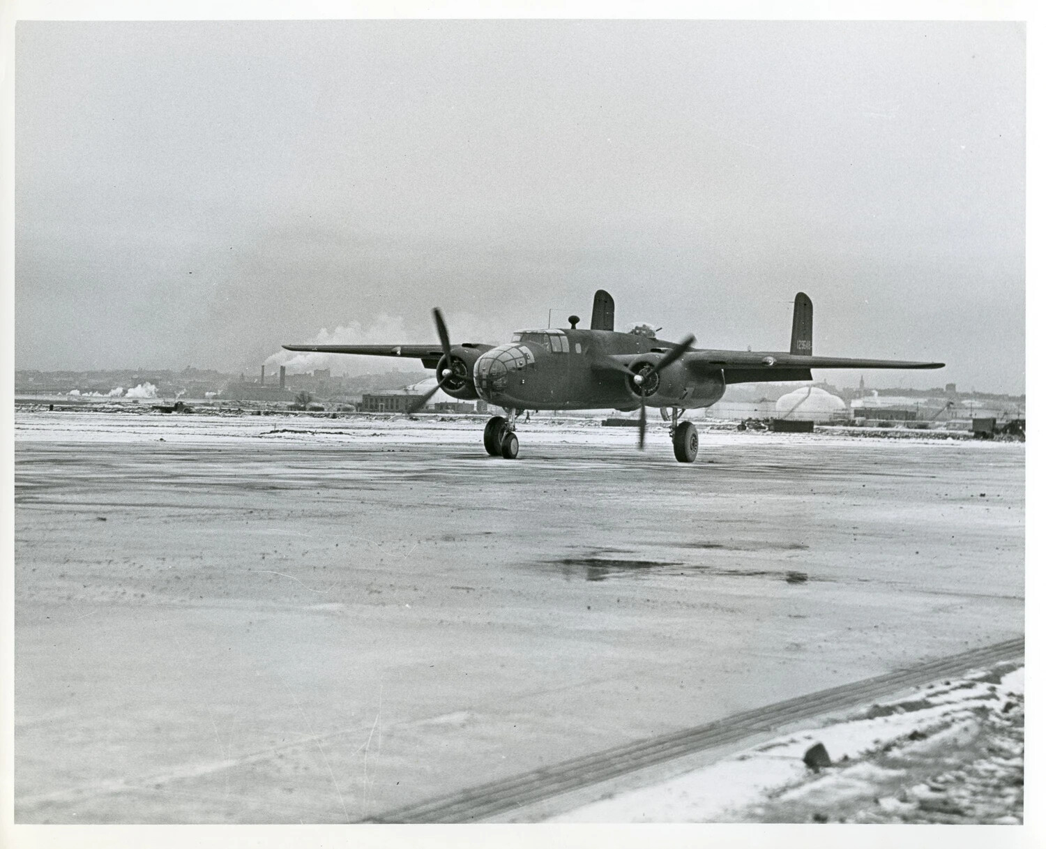 North American B-25 Mitchell Medium Bomber Taxiing on Snow-Covered Airfield