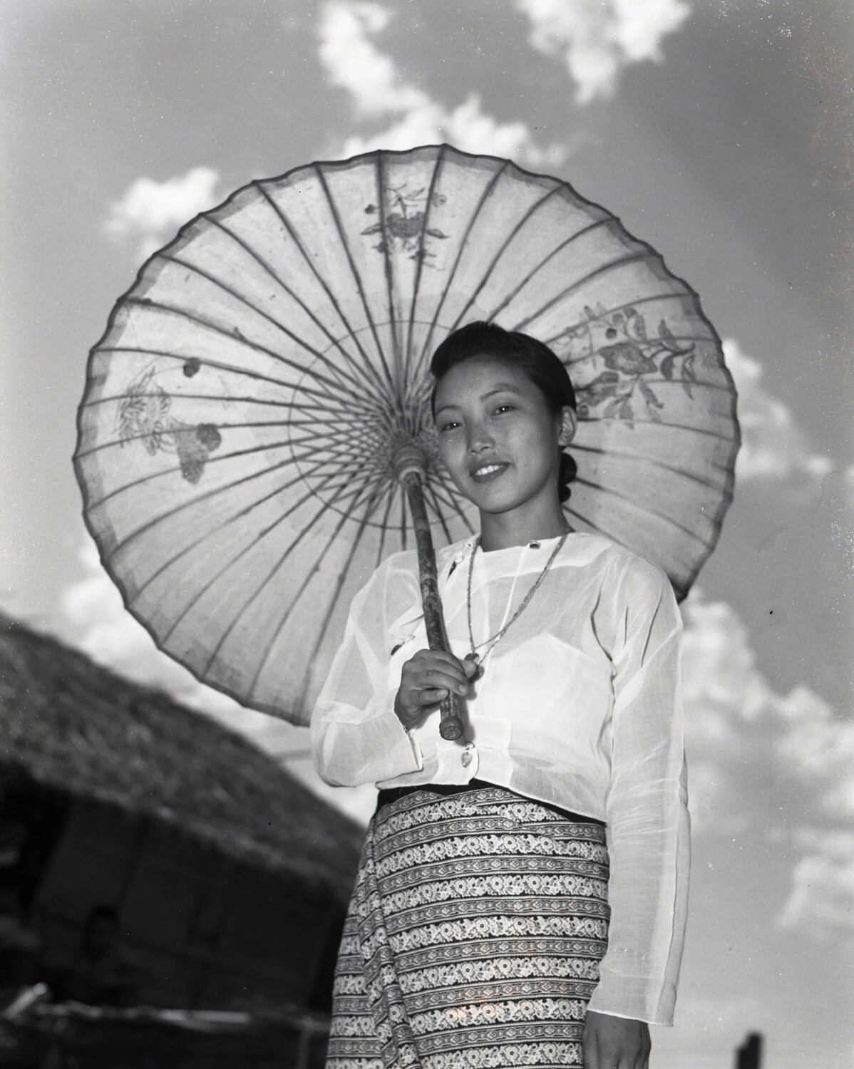 Portrait of a Young Burmese Woman with Decorated Parasol, China-Burma-India Theater