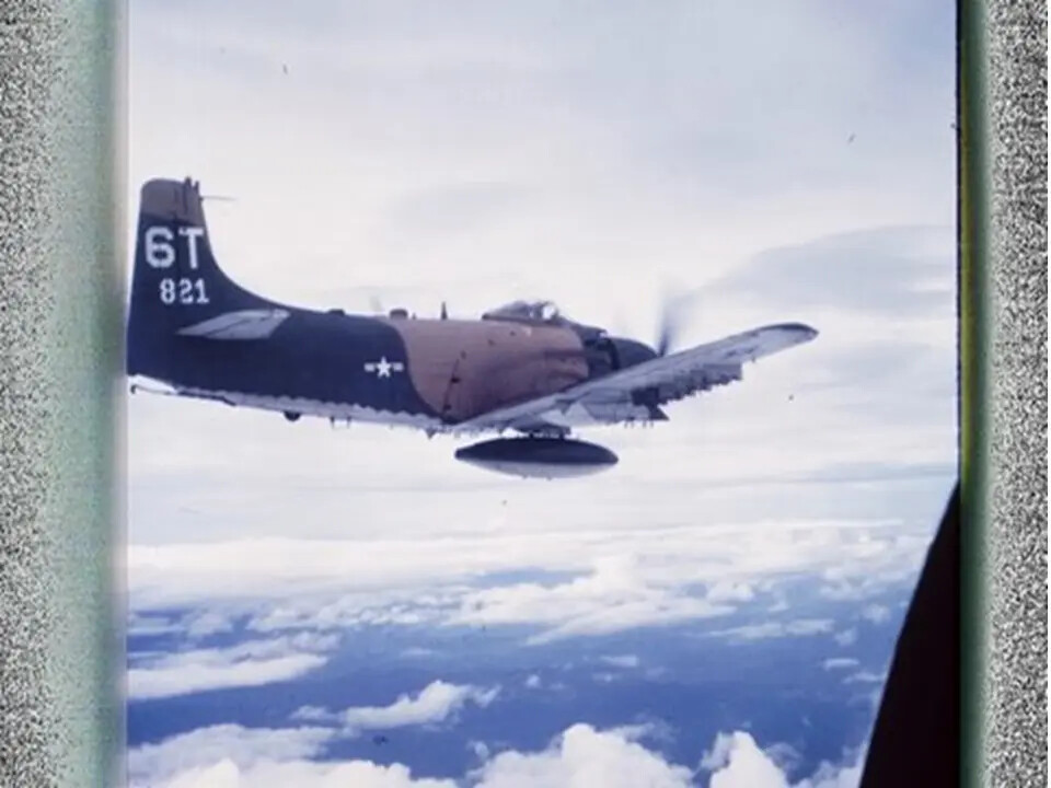 Air-to-Air Photograph of A-1 Skyraider, Tail Code 6T-821, Above Cloud Deck