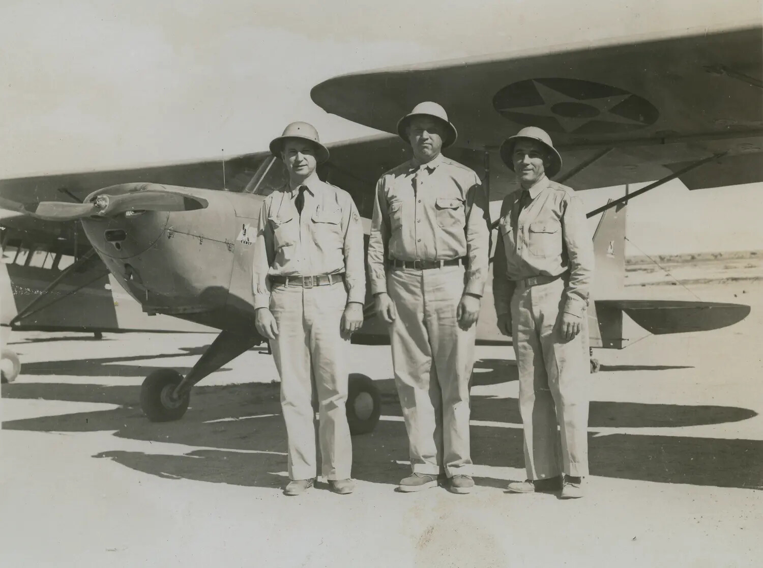 Three Airmen in Pith Helmets with Training Monoplane, Pre-WWII/Early WWII Era