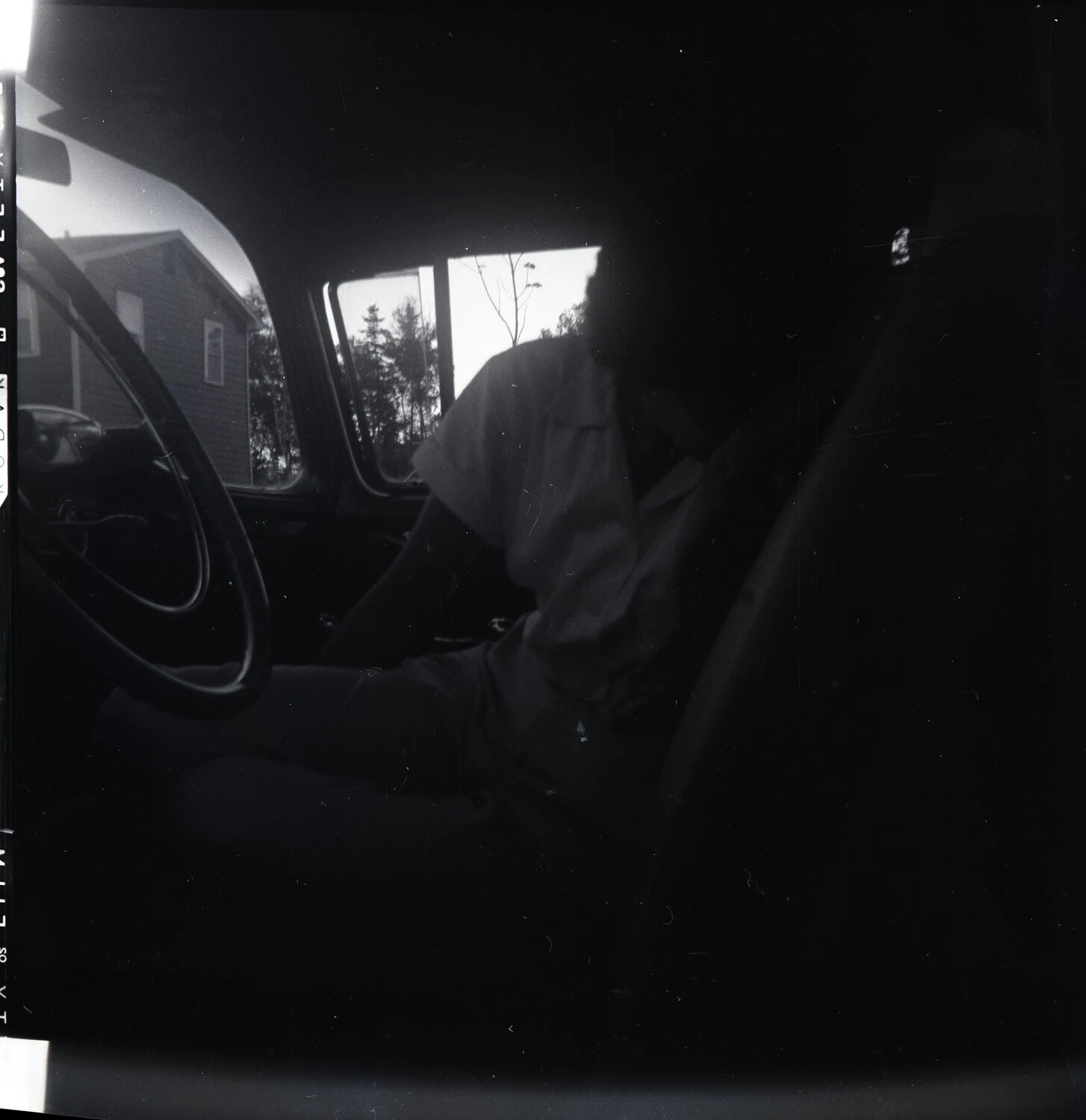 Underexposed Car Interior Photograph with Visible Film Edge Printing
