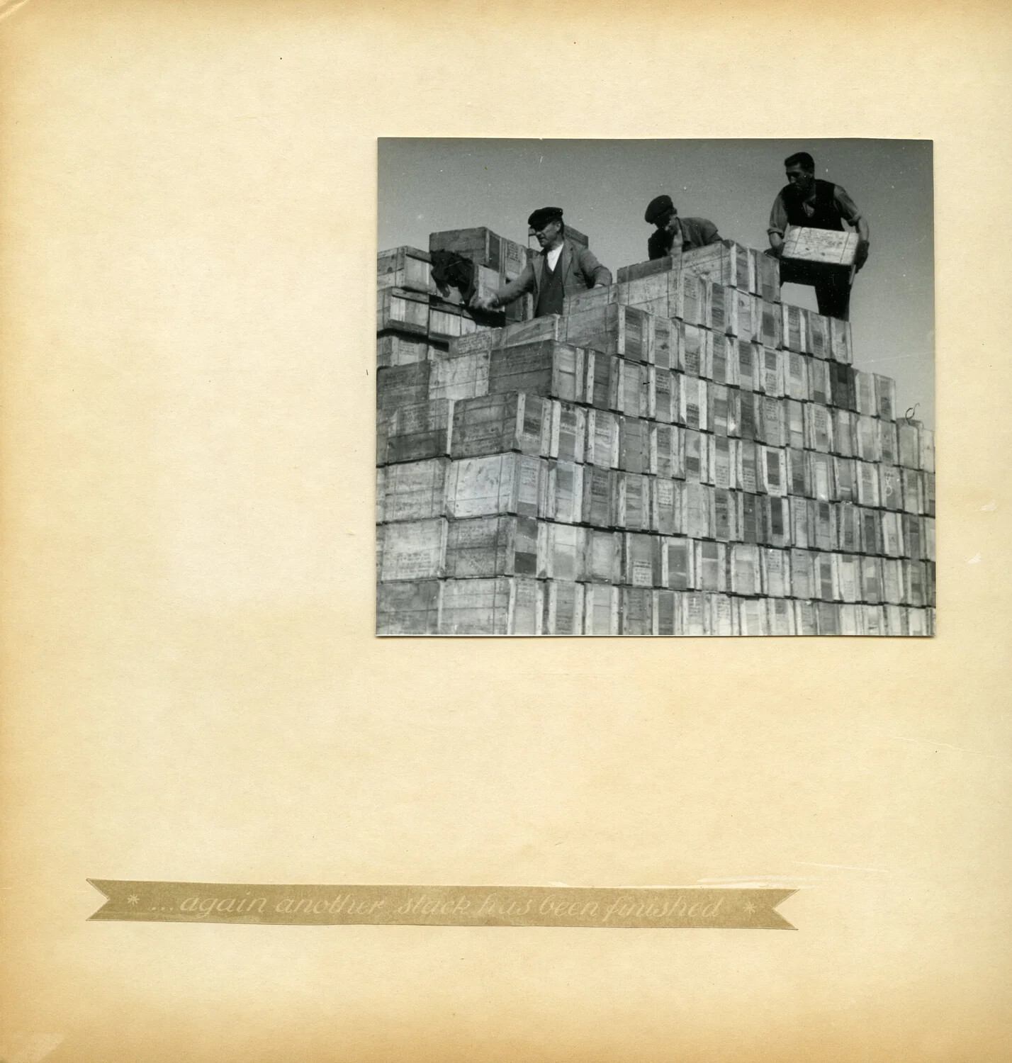 Laborers Atop a Completed Pyramid Stack of Supply Crates, Depot Storage Yard, Germany (Album Page)