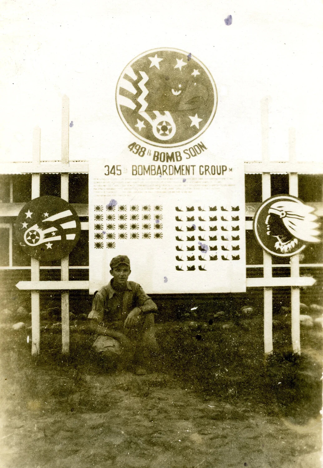 498th Bomb Squadron, 345th Bombardment Group (Medium) Unit Sign and Combat Scoreboard with Airman, WWII Pacific Theater