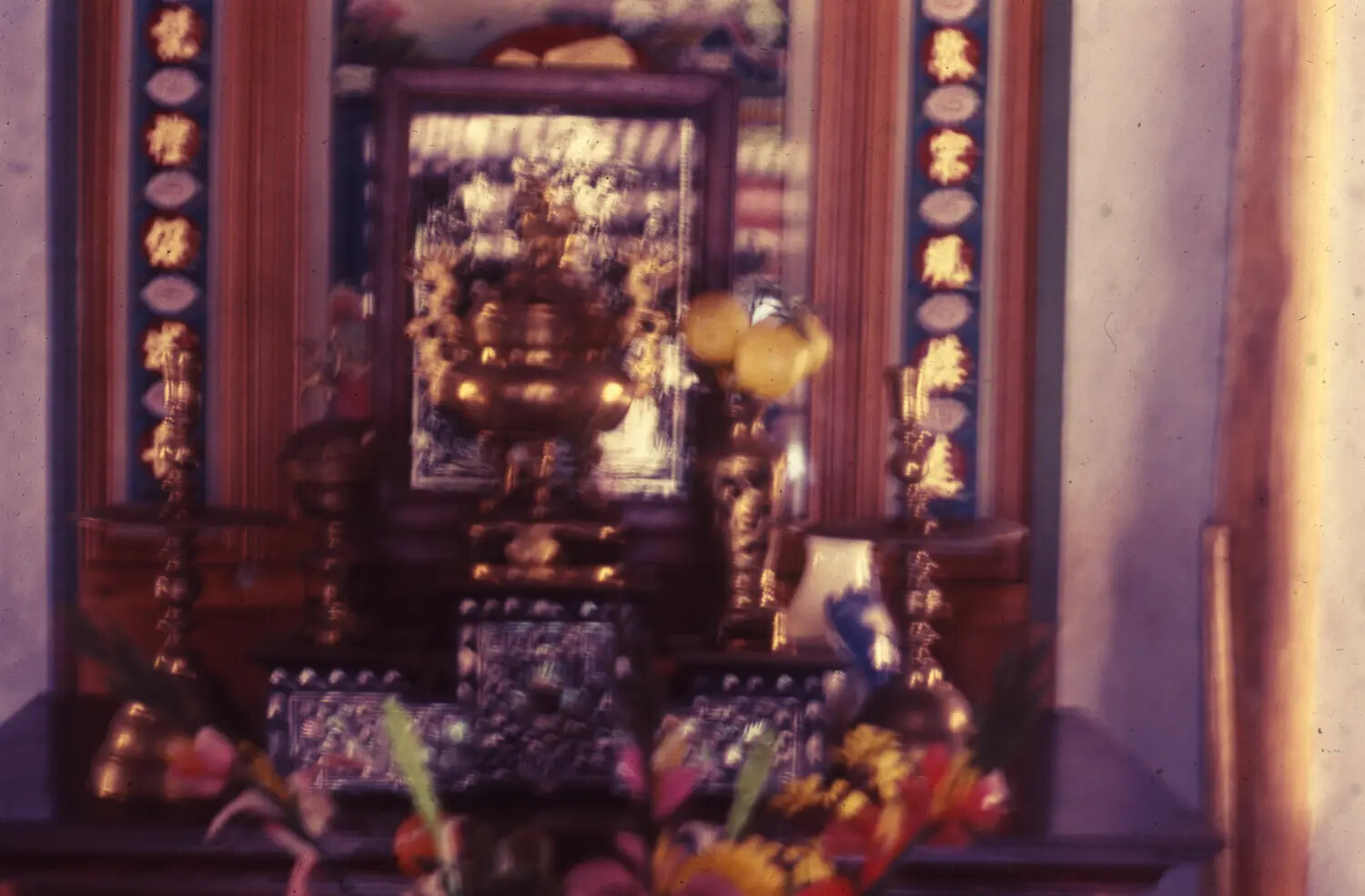 Traditional Vietnamese Ancestral Altar with Brass Incense Burner and Floral Offerings (Alternate View), Vietnam War Era