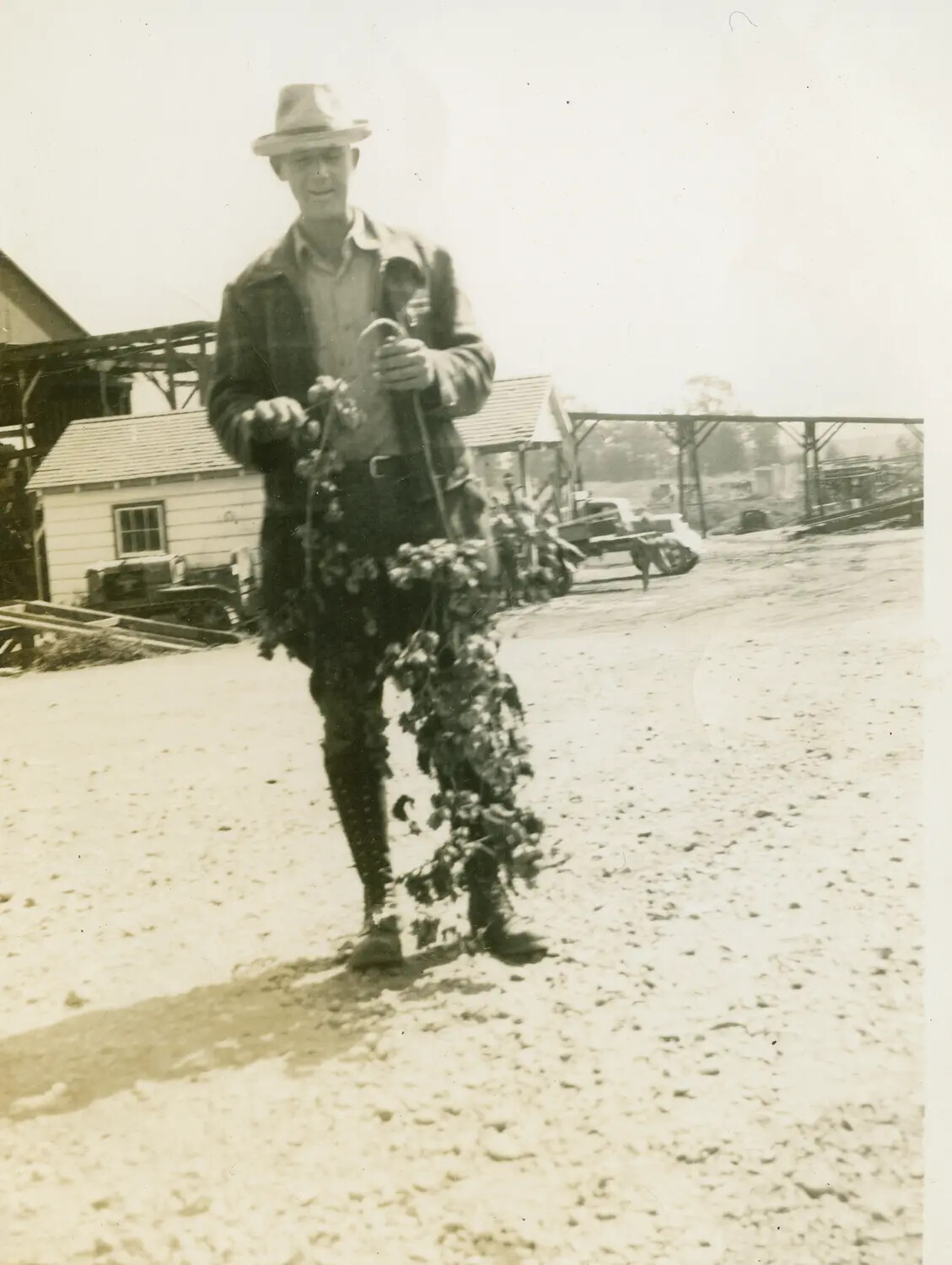 Portrait of Airman Margaroli in Civilian Attire with Vine/Plant, 1944 (B-24 Belly Gunner Collection)
