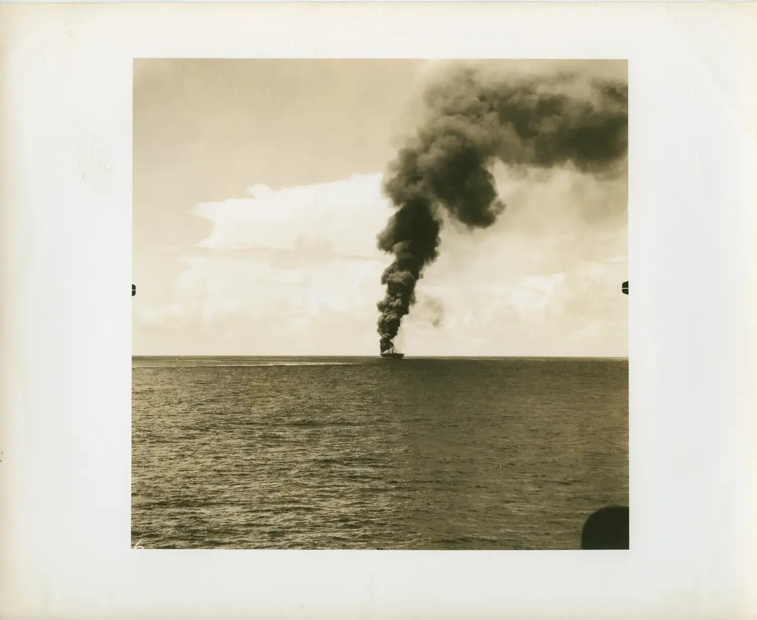 Distant Ship Afire at Sea, Observed from USS Petrof Bay (CVE-80), WWII Pacific Theater