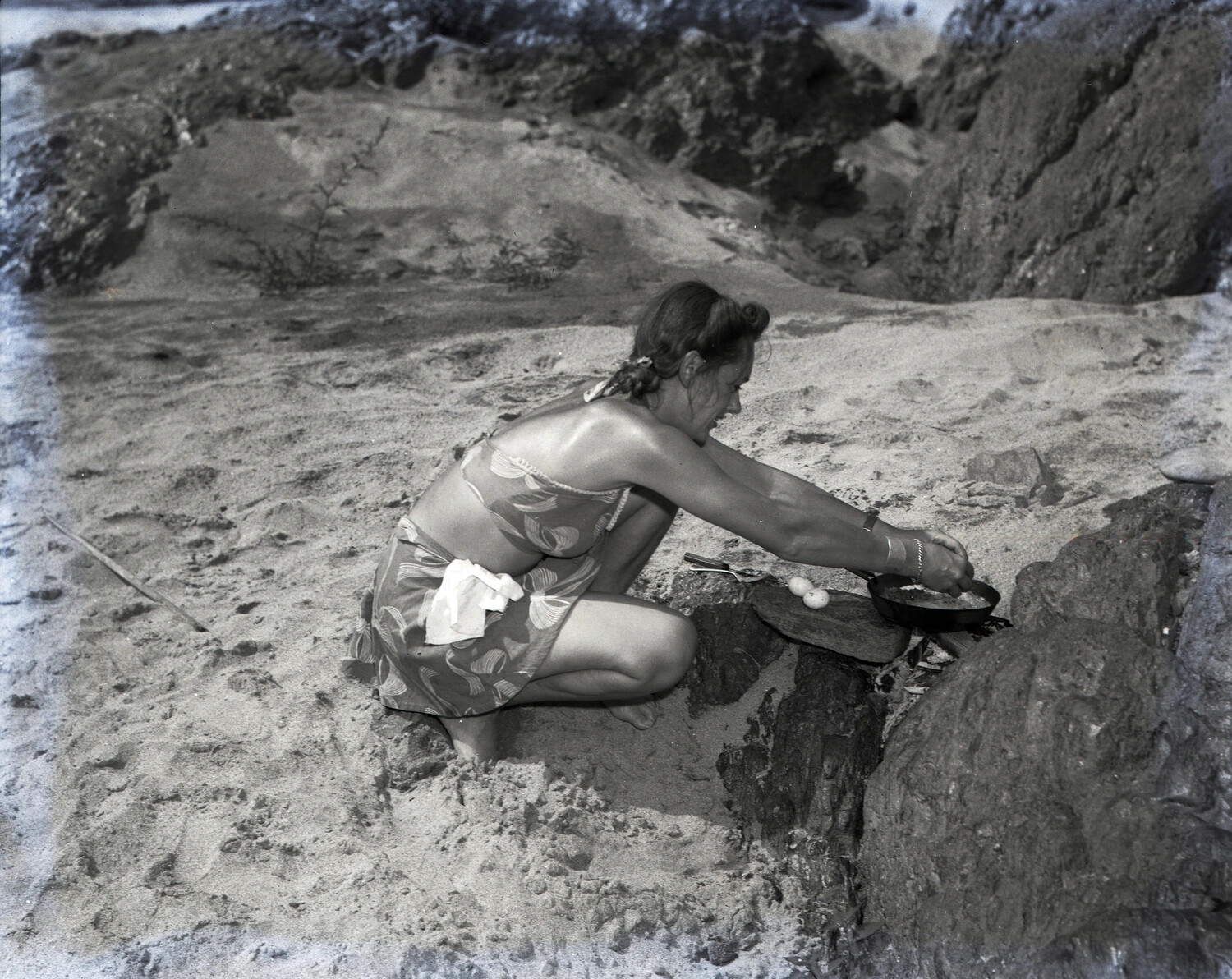 Woman Cooking Over Beach Campfire Among Rocks - Personal Snapshot, Burma Duty Collection