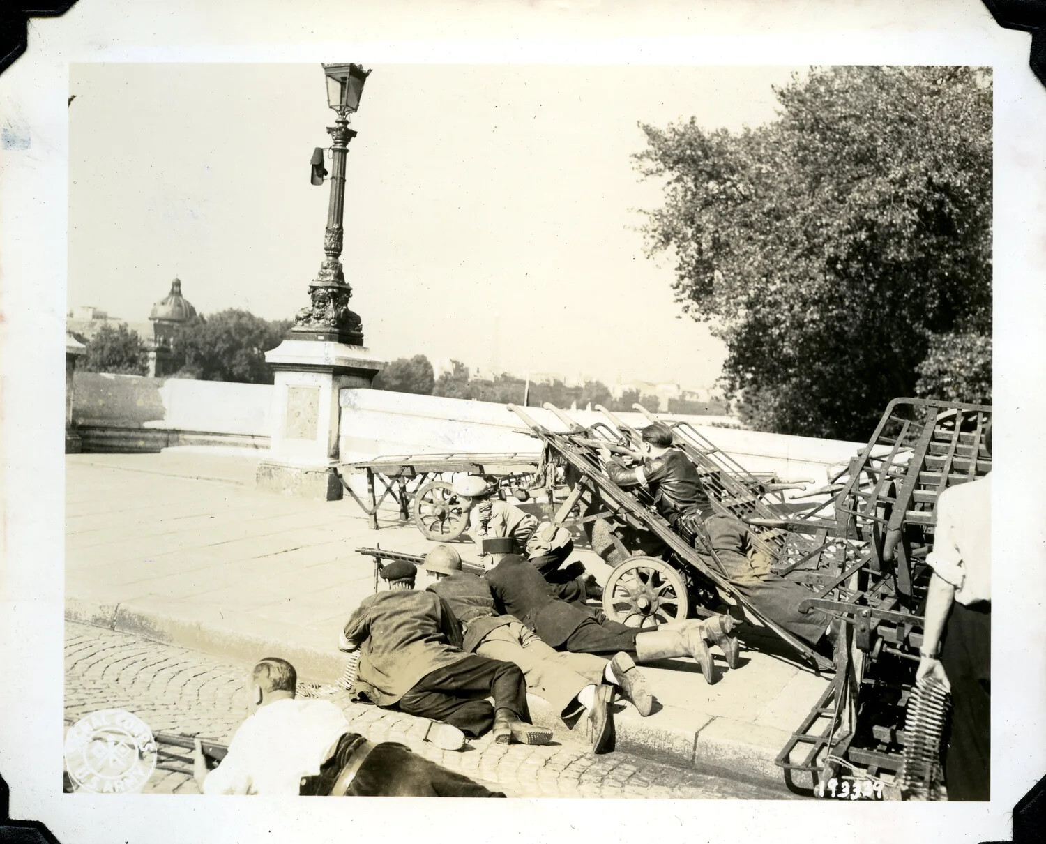 U.S. Army Signal Corps Photograph: Soldiers in Prone Firing Position with Machine Guns on Paris Bridge, WWI