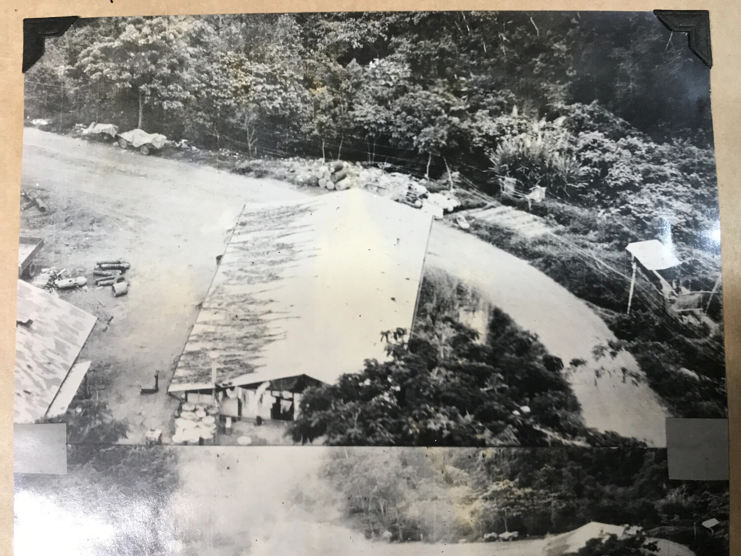 Album-Mounted Photograph: Camouflaged Base Building Beside Jungle Road