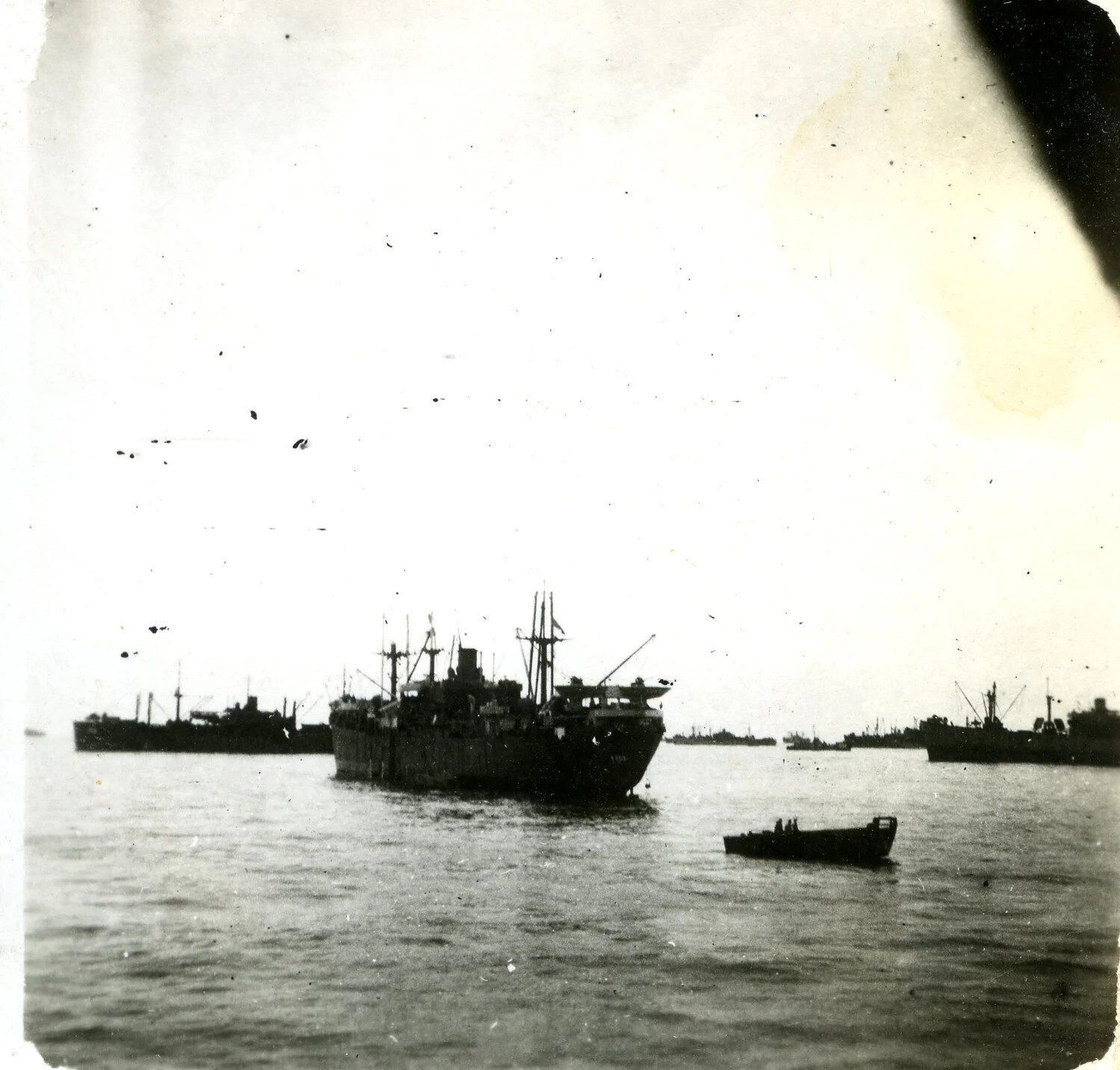 Cargo Ships at Anchor with Passing Launch, Pacific Theater Anchorage, WWII