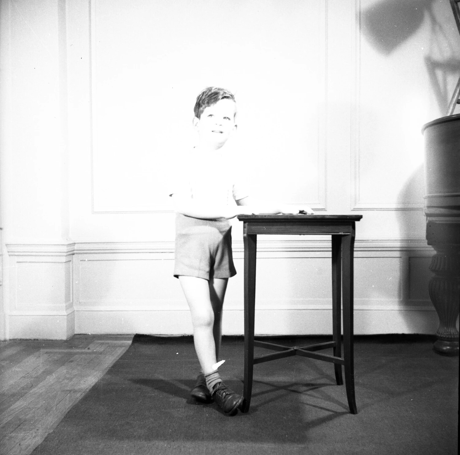 Young Boy Posing Beside Side Table - Domestic Interior Portrait