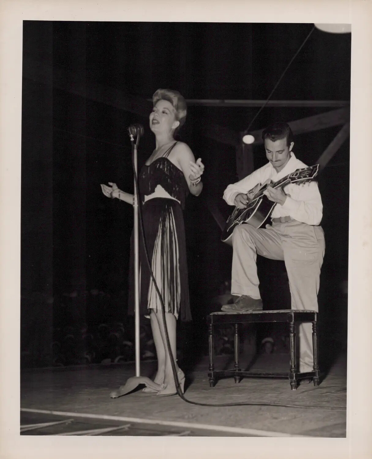 Female Vocalist with Guitar Accompanist on Stage, WWII Era