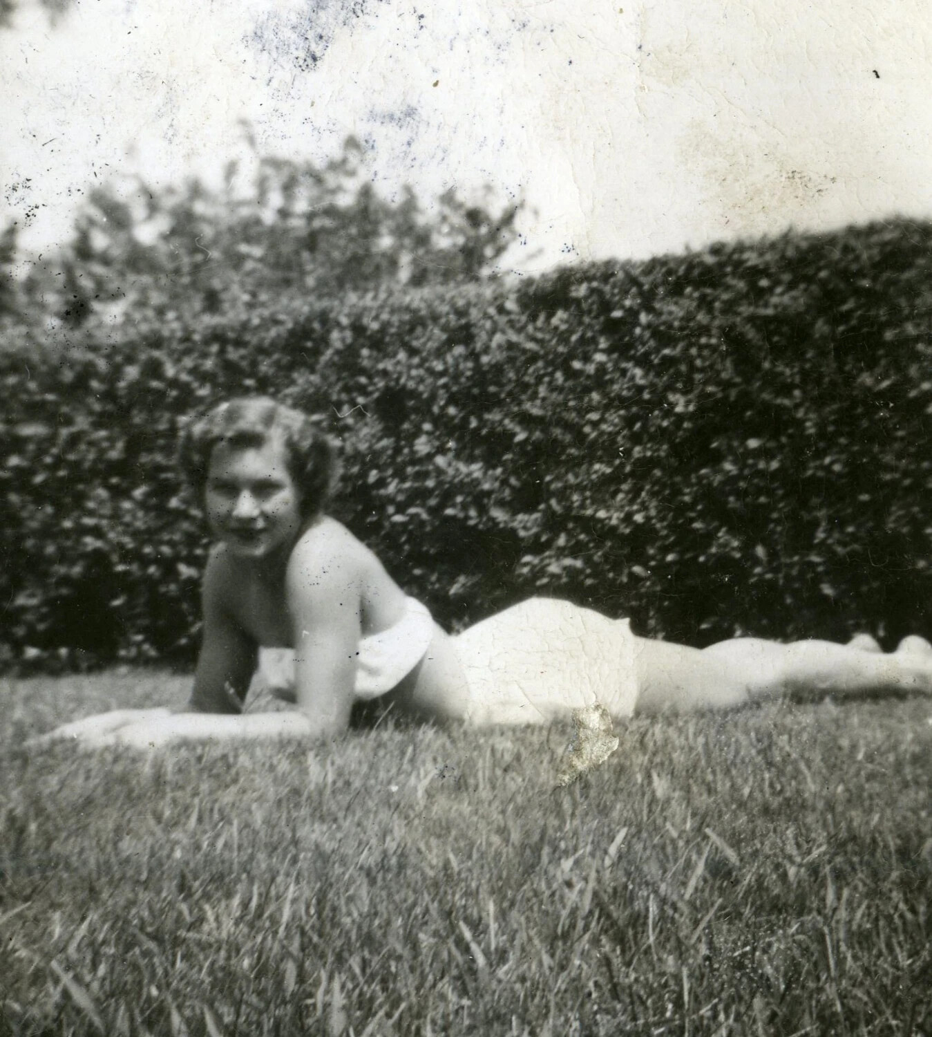 Informal Portrait of a Young Woman Reclining on Lawn, Personal Snapshot (VMF-214 Marine Squadron Album, WWII Era)