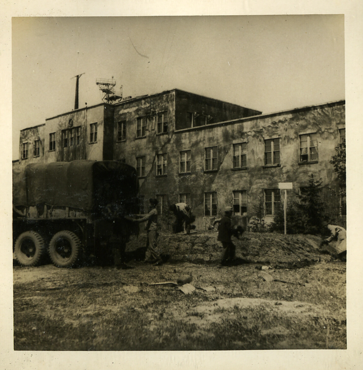 U.S. Military Personnel at Requisitioned Concrete Building with Rooftop Antenna, Postwar Japan