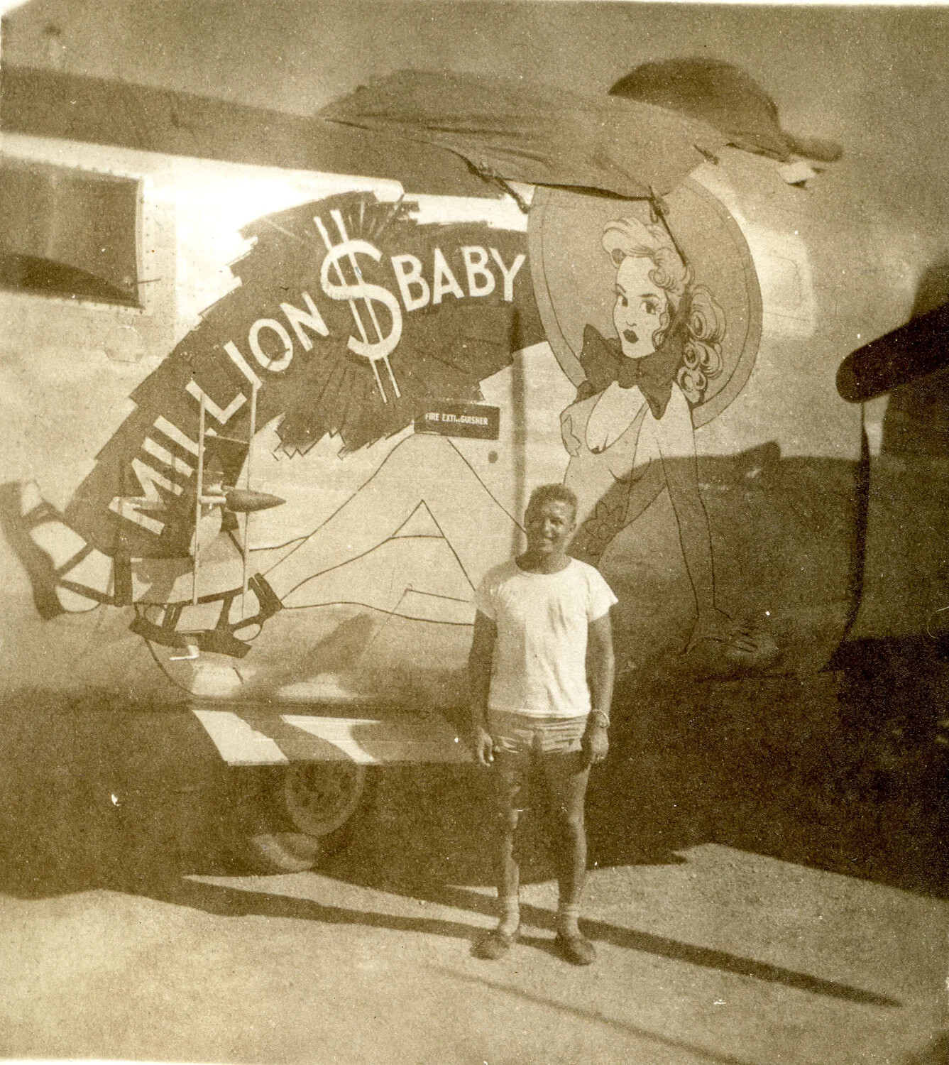 Crewman Posing Before B-25 Mitchell Nose Art 'MILLION $ BABY'