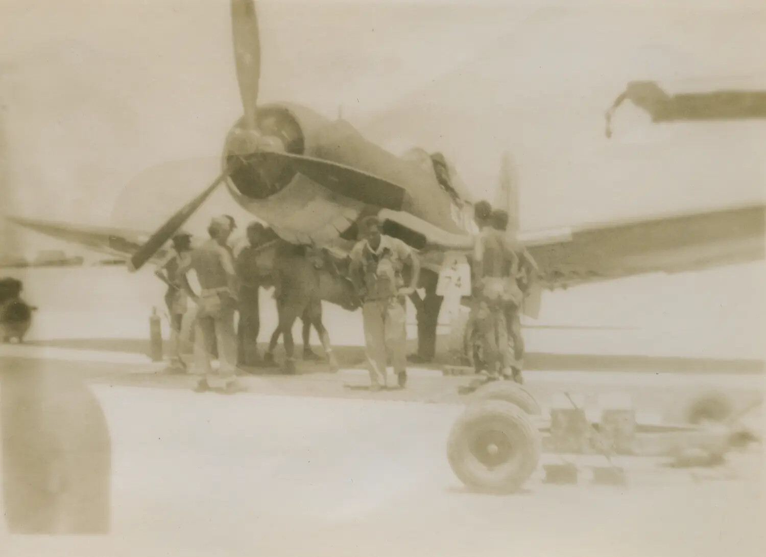 Ground Crew Servicing a Vought F4U Corsair Fighter, Pacific Theater, WWII