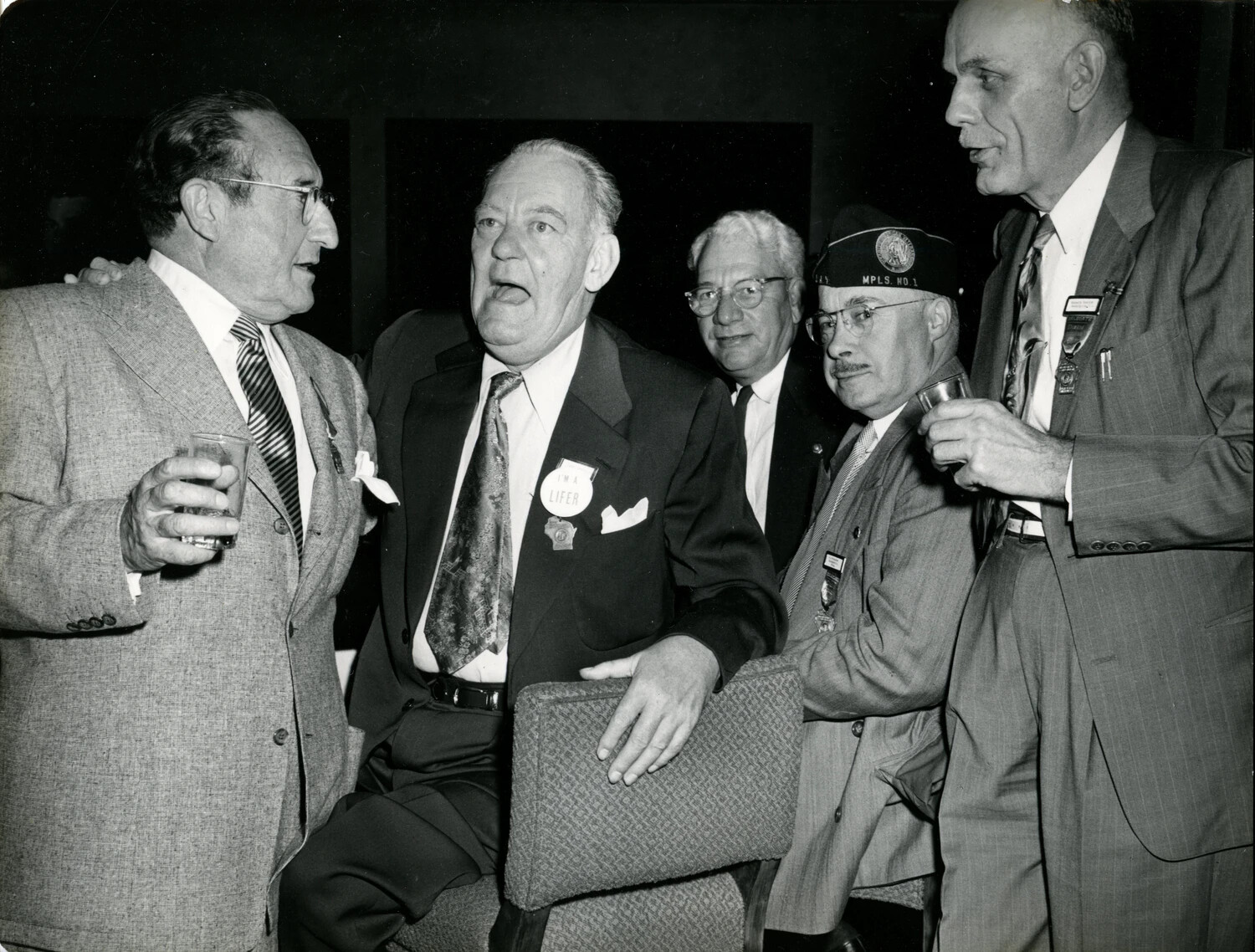 Group Portrait of Men at a Veterans' Reunion or Convention Reception, 1949