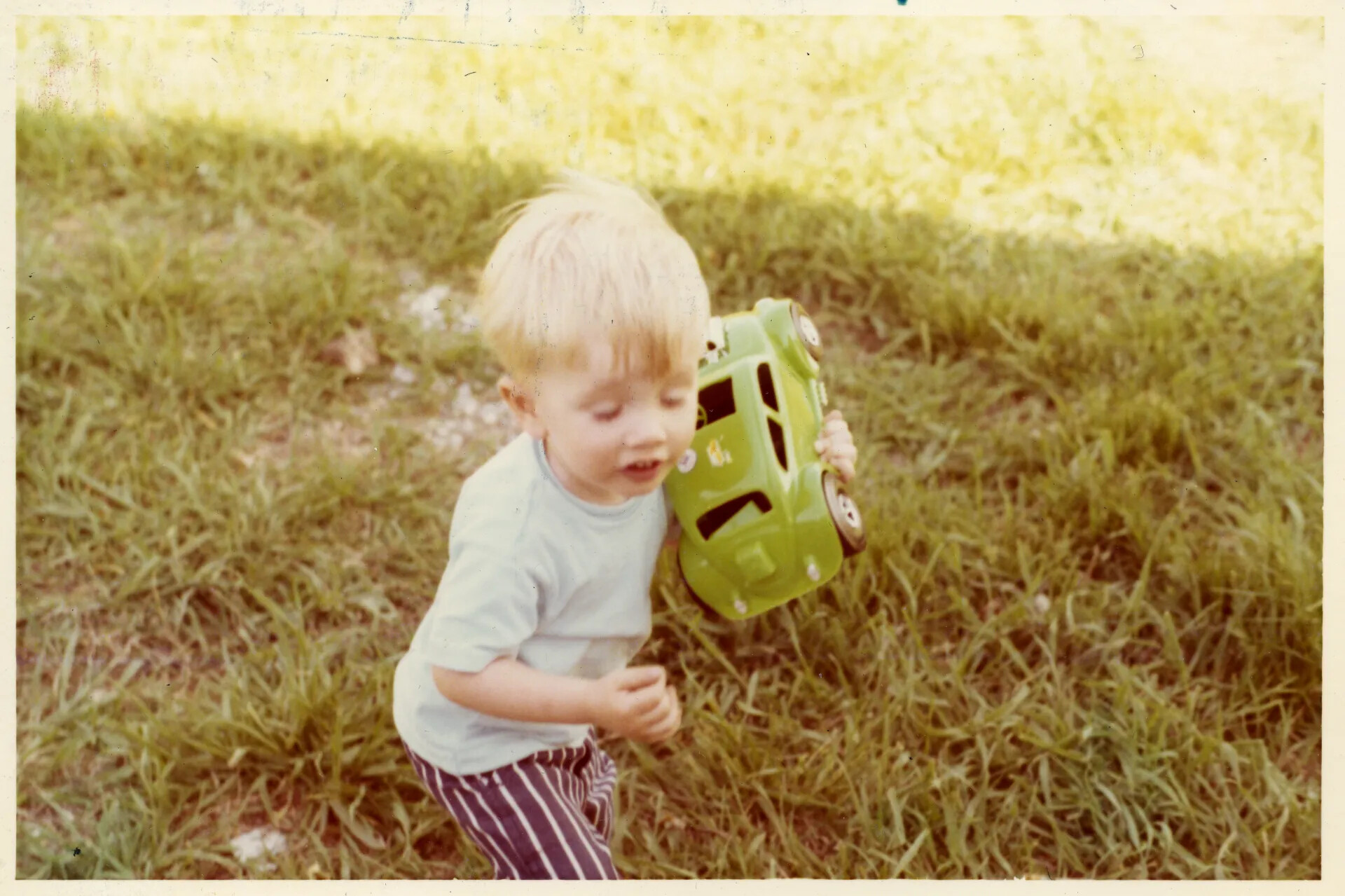 Toddler Playing with Toy Jeep on Lawn, Family Snapshot, Early 1970s