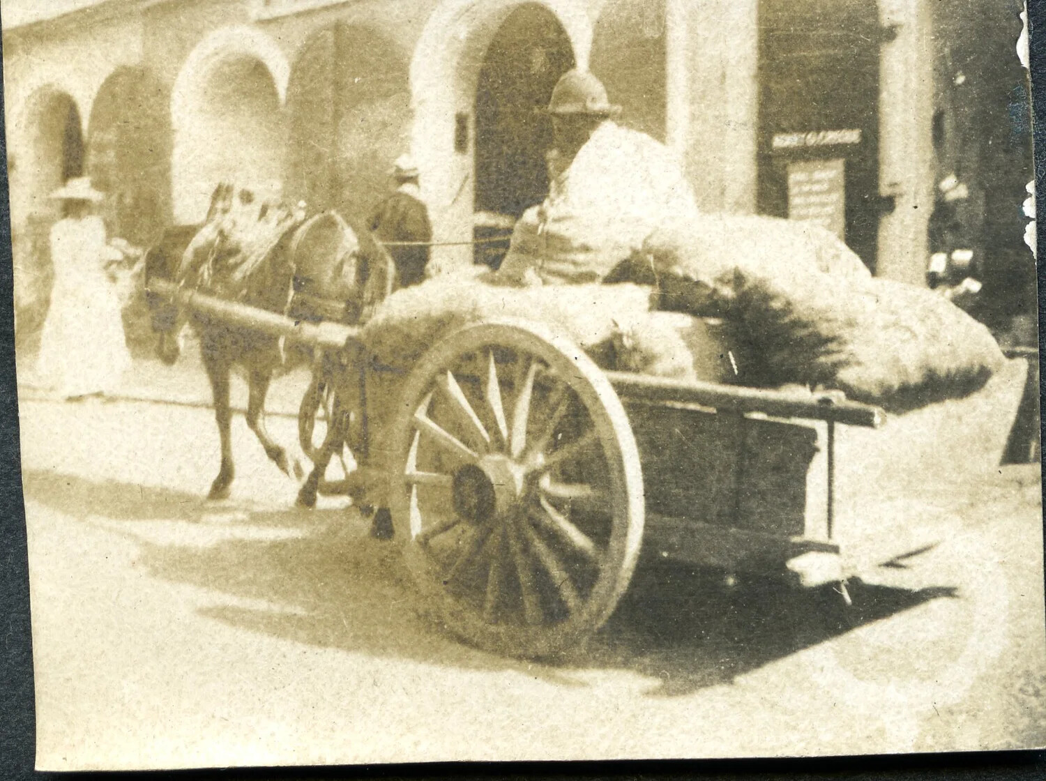 Horse-Drawn Supply Cart and Figure in Adrian Helmet, European Street Scene, World War I Era