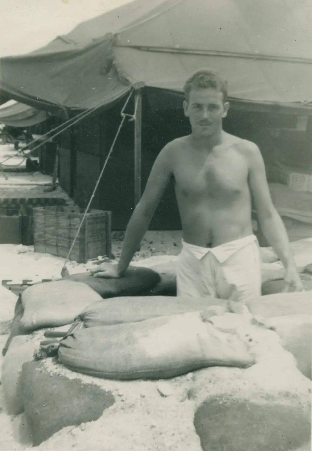 Serviceman at Sandbagged Tent Camp, Pacific Theater, World War II