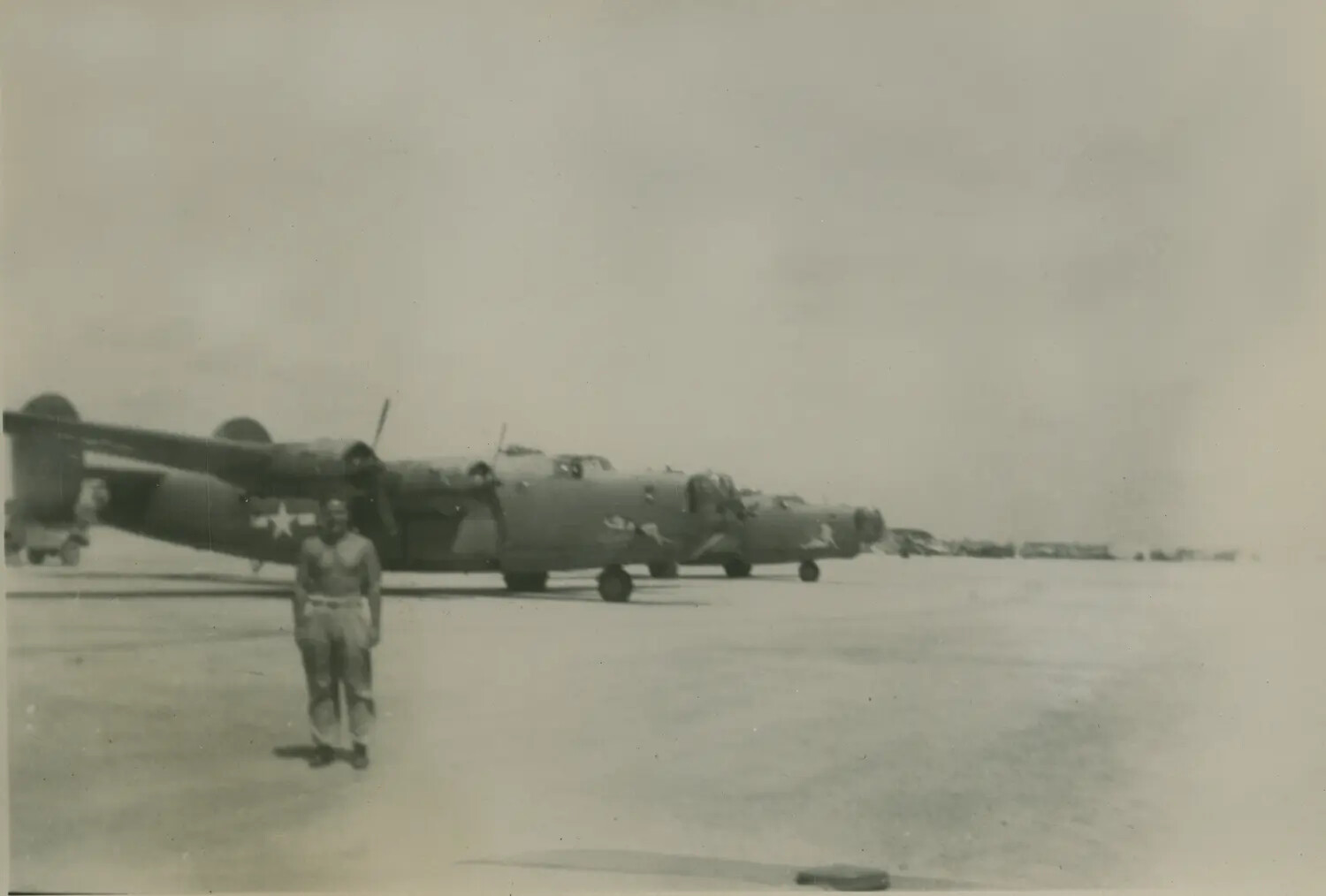 B-24 Liberator Bombers on Flight Line with Airman, World War II