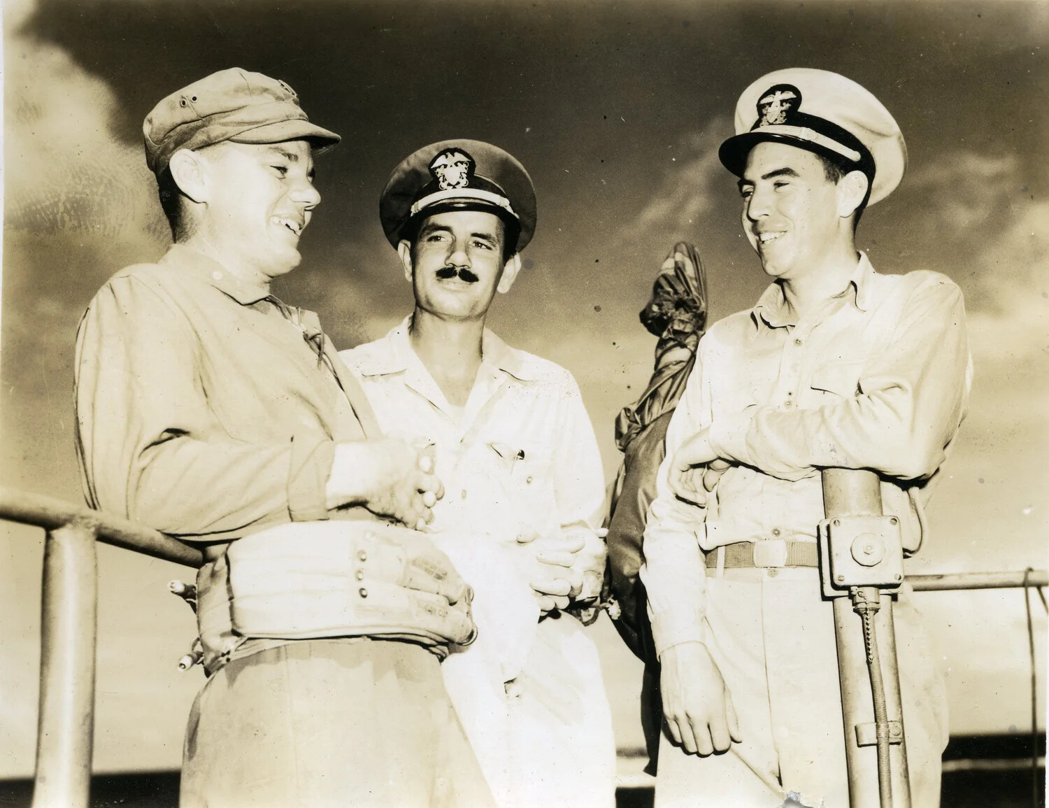 Three Officers Meet on Deck: U.S. Army and U.S. Navy Personnel, LST-669, Pacific Theater, February 1945