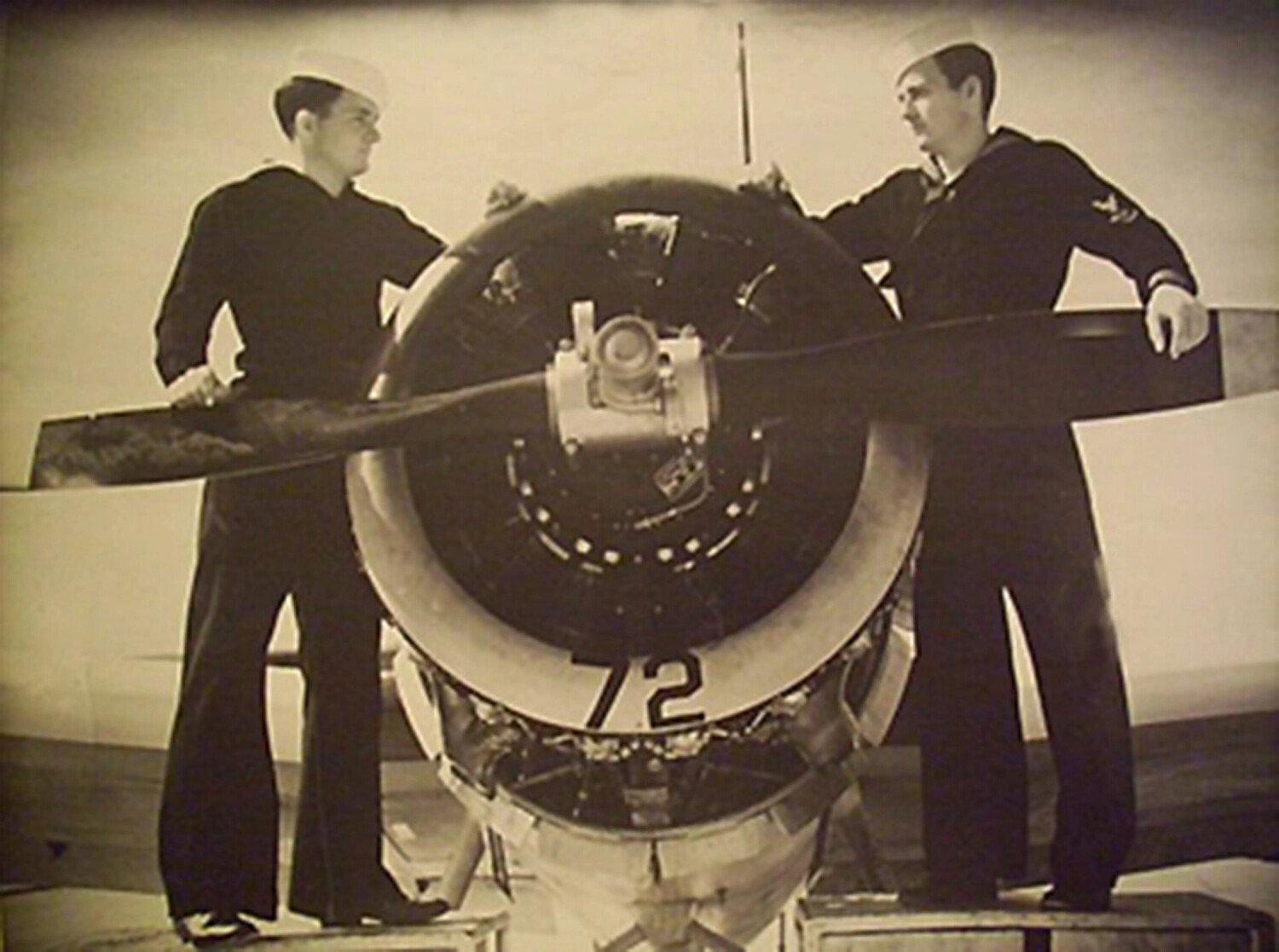 Two U.S. Navy Sailors Posed at the Propeller of Training Aircraft No. 72, NAS Pensacola, April 1949