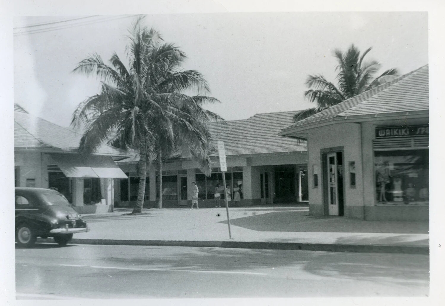 Storefronts and Palm Trees on a Waikiki Street, Honolulu, Hawaii, Late 1940s
