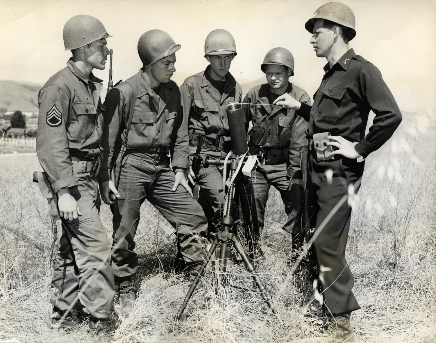 Officer Instructs Enlisted Soldiers on Optical Sighting Instrument, Field Training Exercise