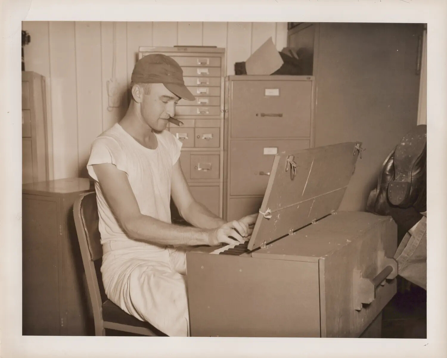 Sailor Playing a Portable Field Organ, Candid Photograph, WWII Era