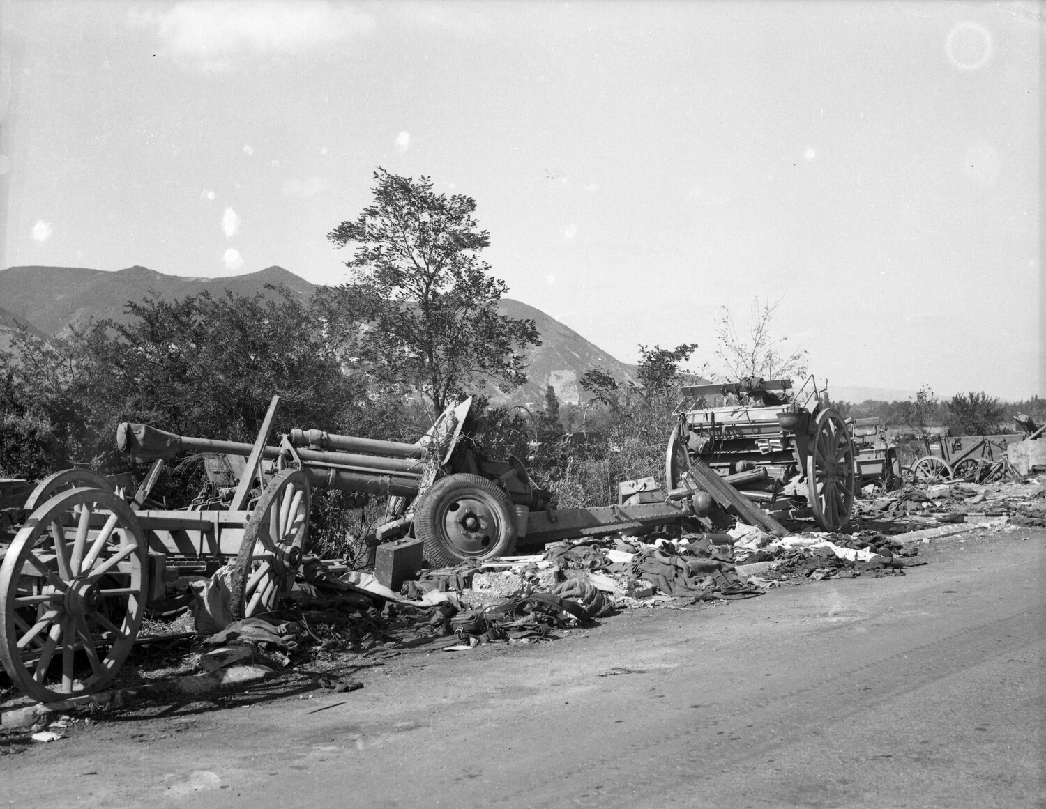 Abandoned German Field Howitzer and Wrecked Wagons, World War II