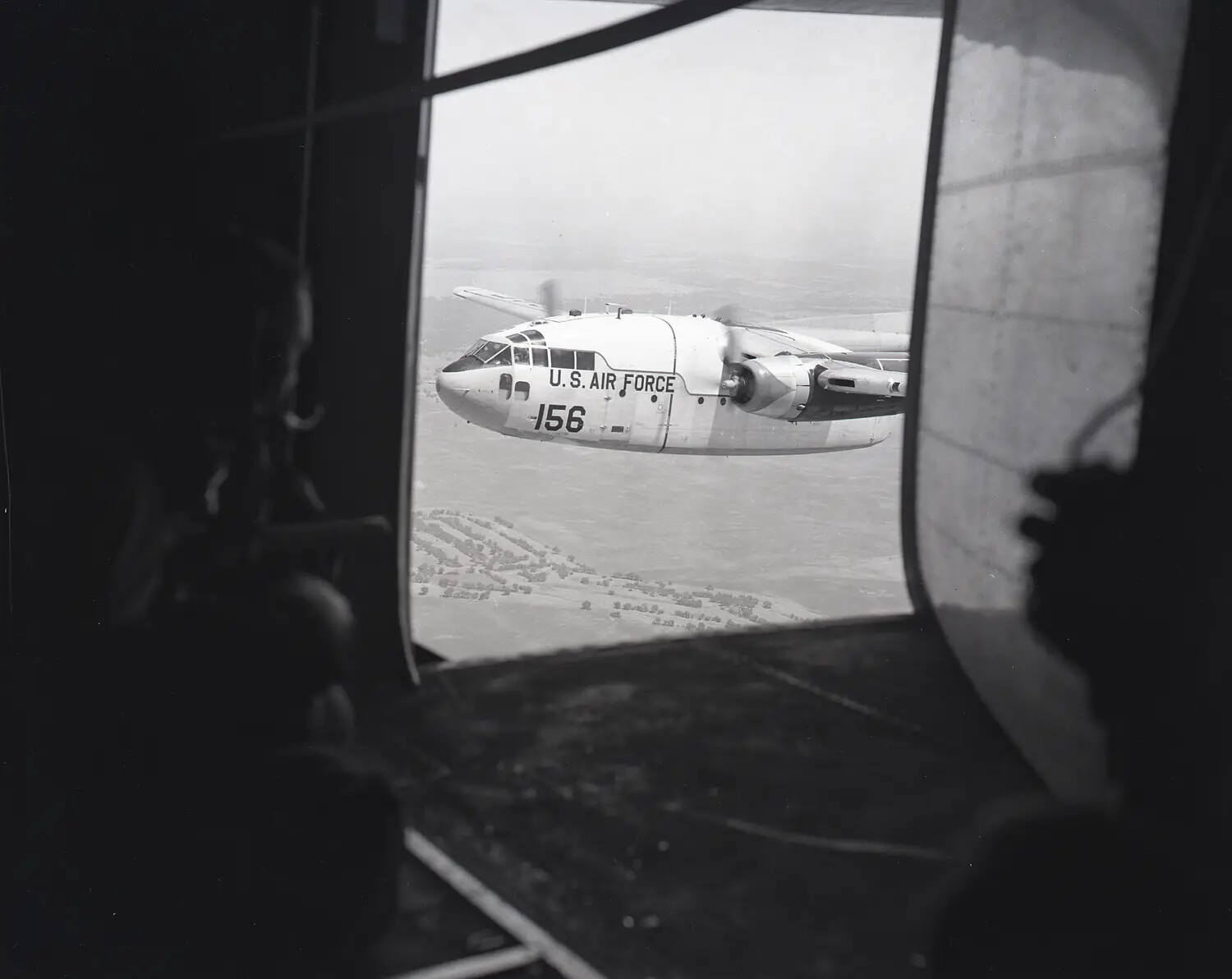 C-119 Flying Boxcar in Formation, Viewed from Open Paratroop Door
