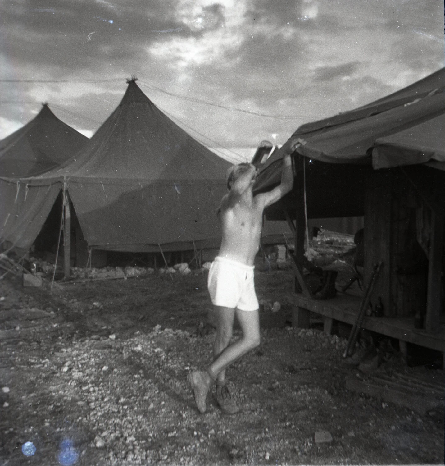 Serviceman Drinking from a Can Outside Tent Camp, Ie Shima