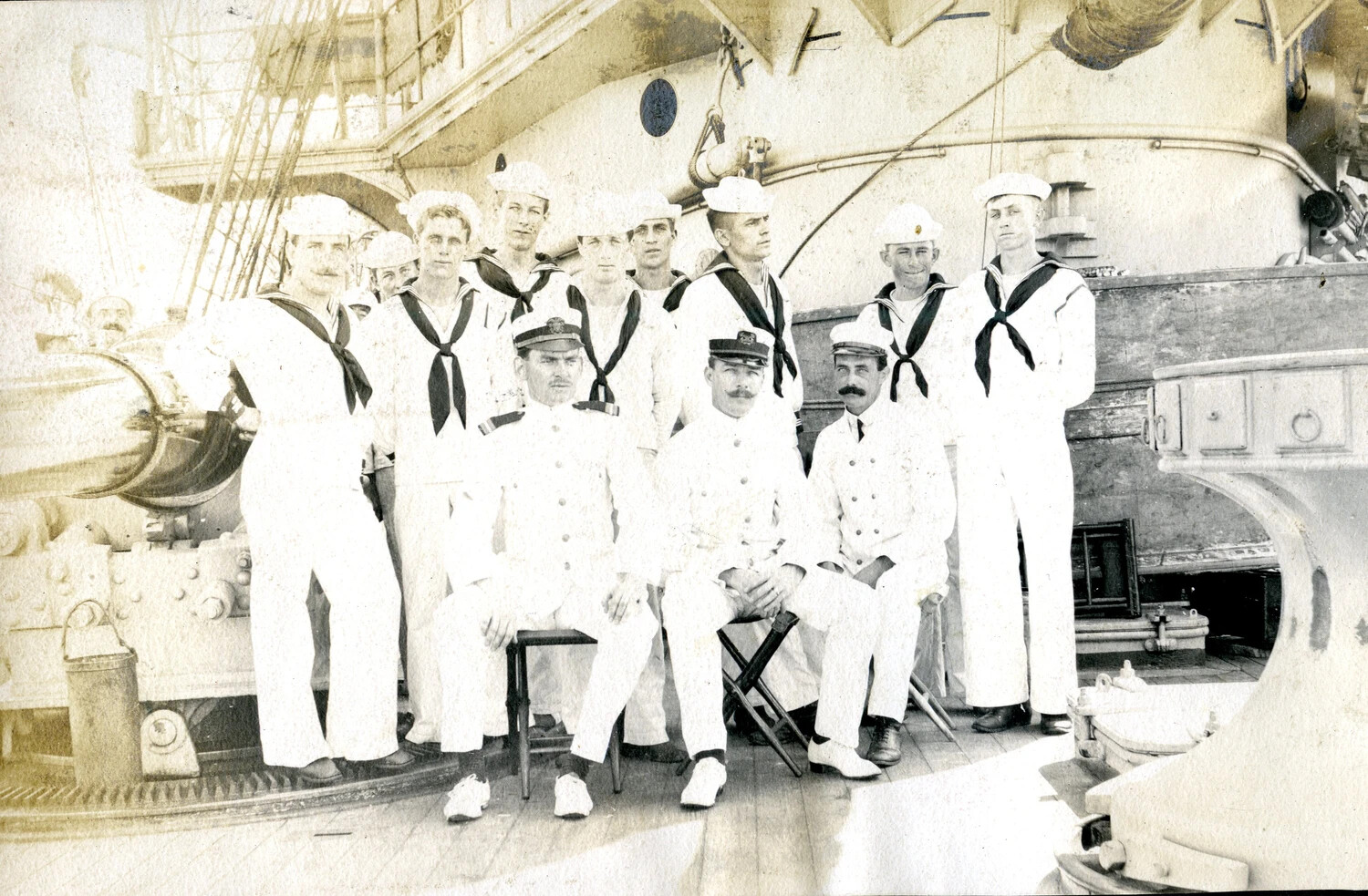 Officers and Enlisted Gun Crew Posed on Deck Beside Ship's Gun, USS Columbia, c. 1898-1910