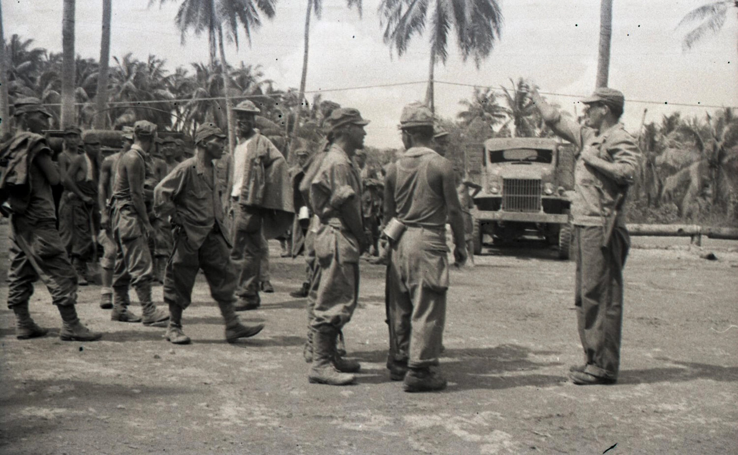 American Servicemen Gathering with Military Truck at Camp, Luzon, Philippines, WWII