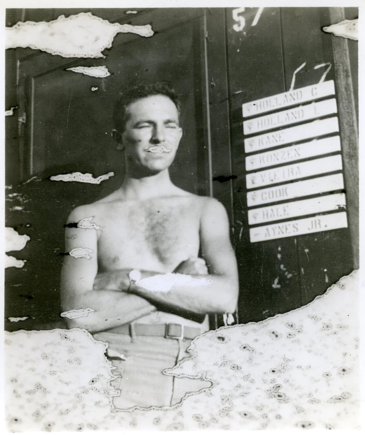 Serviceman Posing Beside Berth Nameplate and Compartment Number '57,' World War II Era