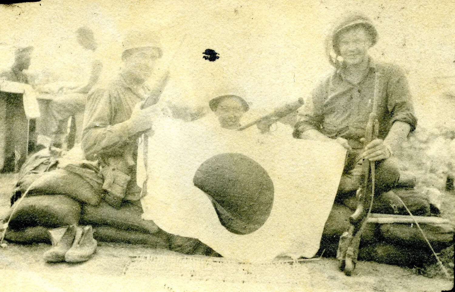American Soldiers Displaying a Captured Japanese Flag, Pacific Theater, WWII
