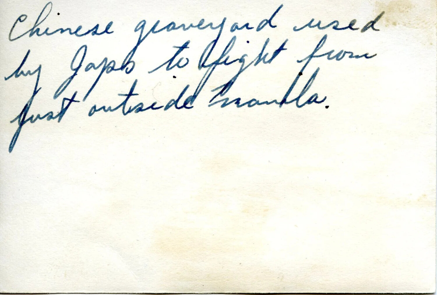Verso of Photograph with Handwritten Caption: "Chinese Graveyard Used by Japs to Fight From Just Outside Manila"