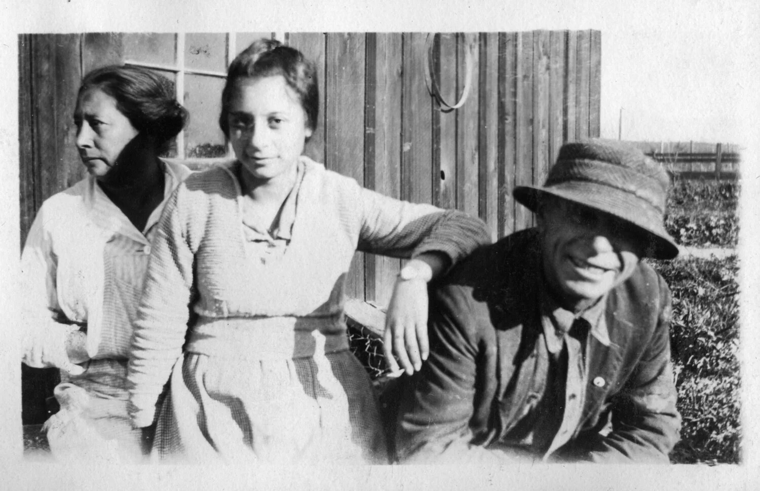 Informal Group Portrait of Two Women and a Man Outside a Wooden Building, Presidio Album, c. 1920s-1930s