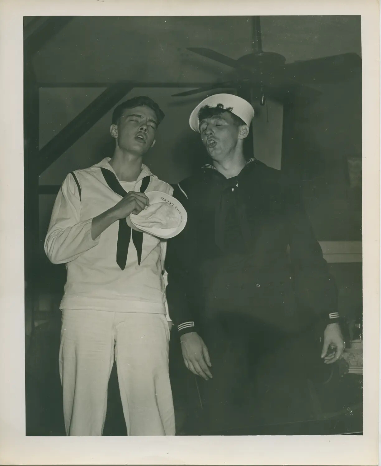 Two U.S. Navy Sailors Singing Off-Duty, WWII Era