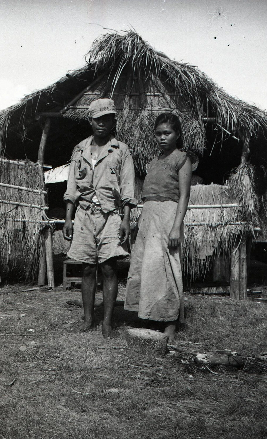 Filipino Civilians in Front of Nipa Hut, Luzon, Philippines, World War II Era