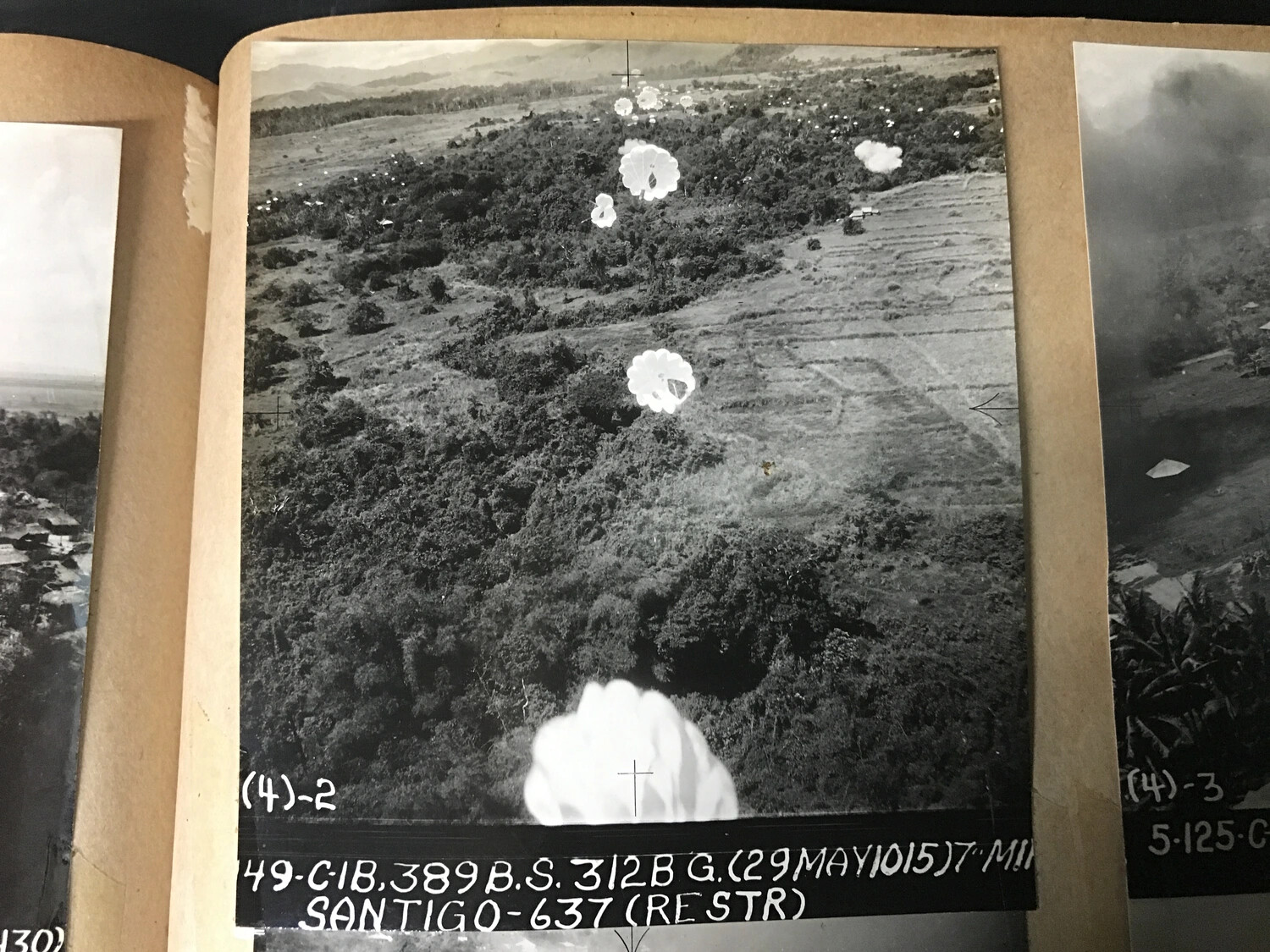 312th Bomb Group Strike Photograph — Parafrag Bomb Train in Descent, Santiago, Isabela, Luzon, 29 May 1945
