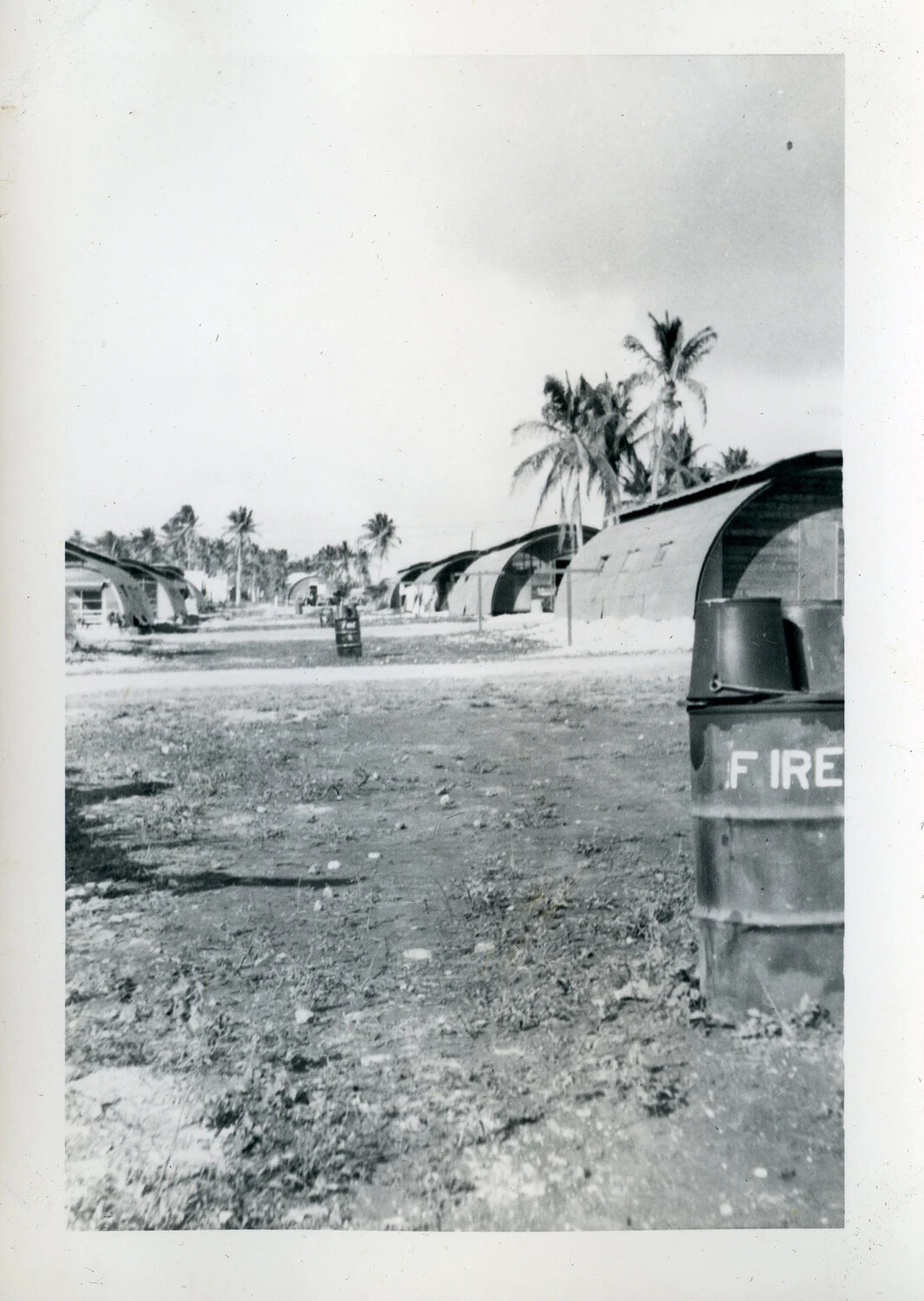 Quonset Hut Row and "FIRE" Barrel, NATS Squadron VR-6 Base, Agana, Guam