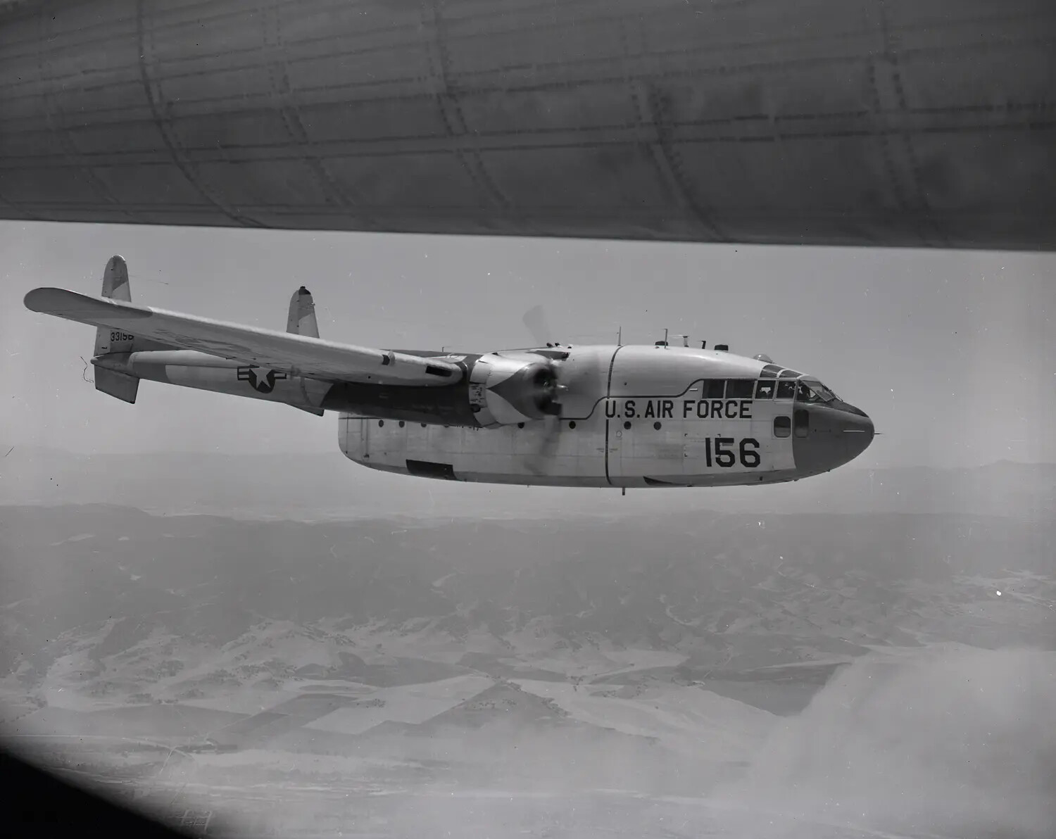 Fairchild C-119 Flying Boxcar in Formation Flight, Close Three-Quarter View