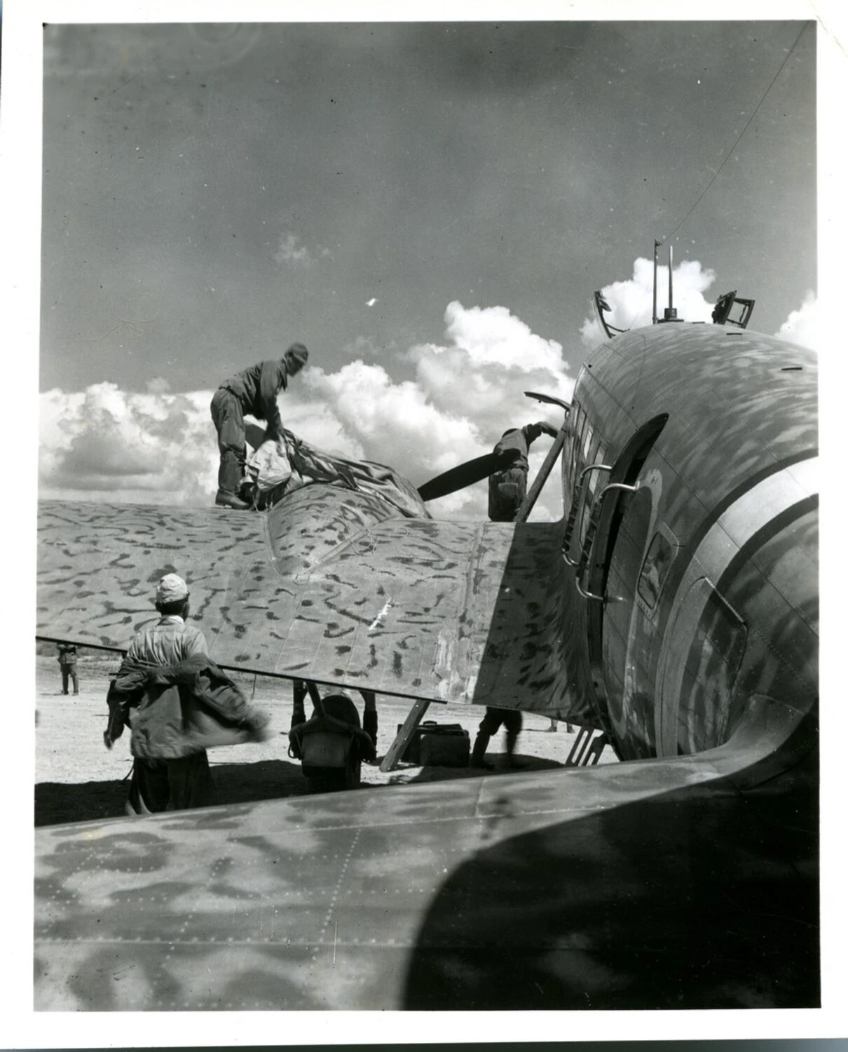 Ground Crew Loading Cargo onto Camouflaged Military Aircraft, WWII CBI Theater
