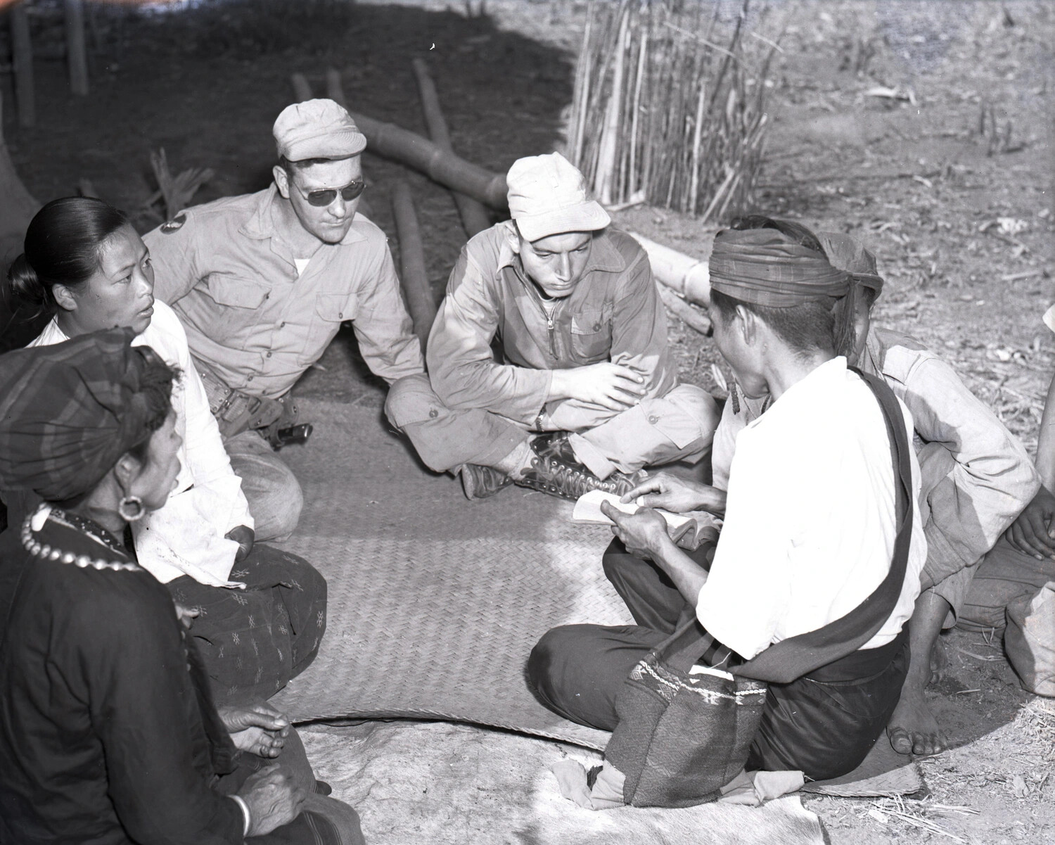 American Servicemen in Council with Kachin Villagers, Burma, WWII China-Burma-India Theater